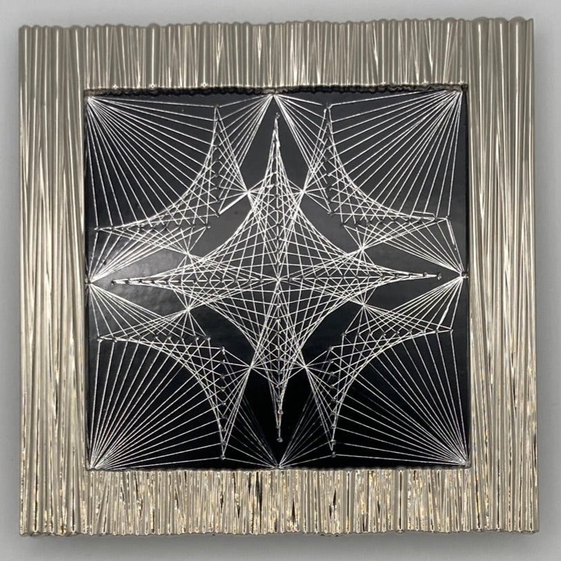 silver framed Tri-Dot Tile